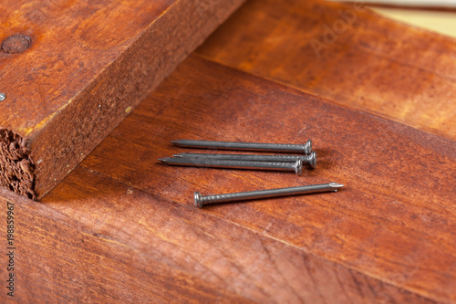 iron nails on a wooden table © fotofabrika