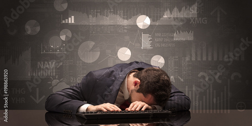 Young businessman sleeping with charts, graphs and reports on the background

