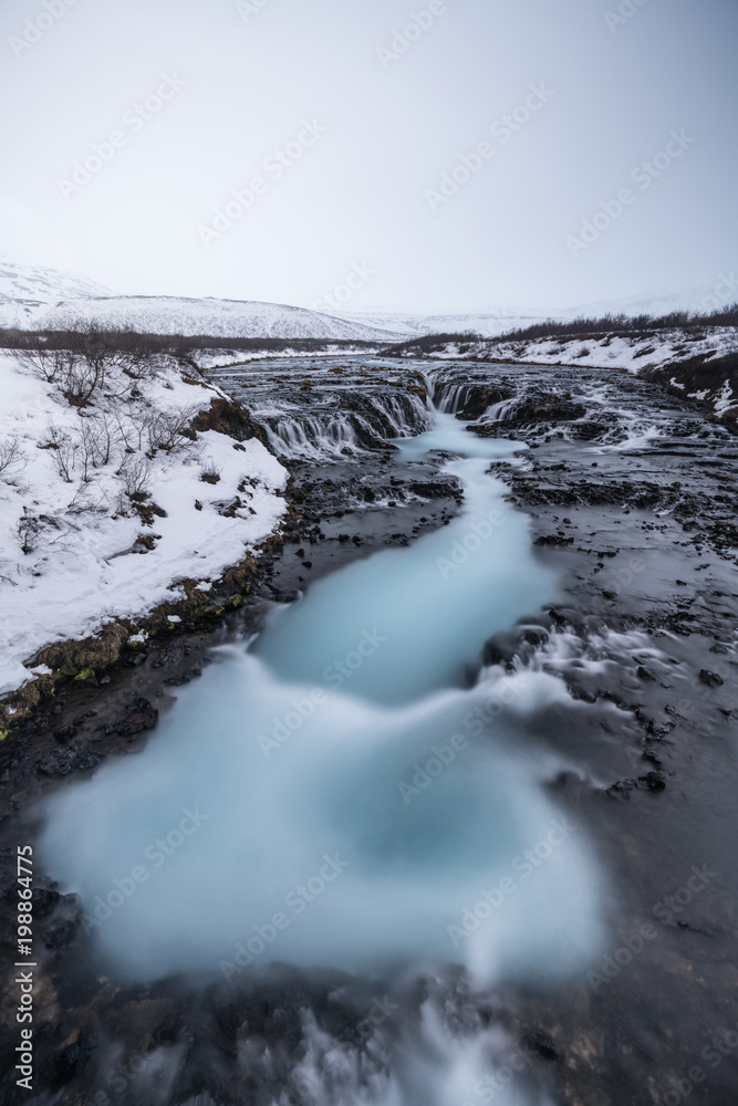 Top view of Bruarfoss Waterfall one of amazing landmark in Iceland. Its looks like marble pattern.Abstract concept for graphic designer inspiration Top view of Bruarfoss Waterfall one of amazing landmark in Iceland. Its looks like marble pattern.Abstract concept for graphic designer inspiration