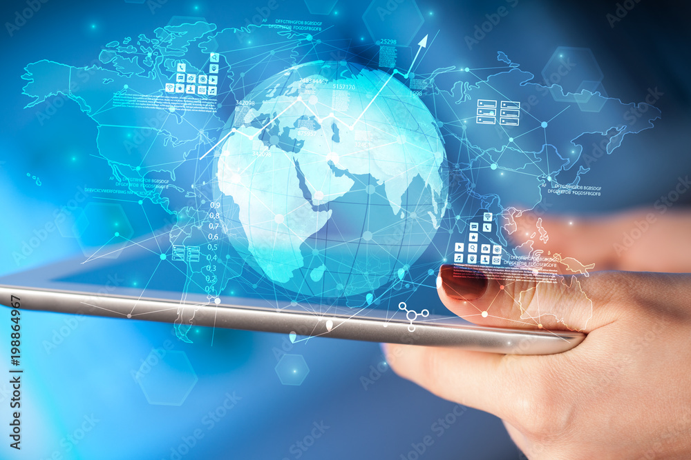 Hand using tablet with multinational worldwide estate report concept
