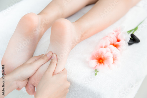 Fototapeta Naklejka Na Ścianę i Meble -  Hand press at Foot Massage and Spa concept white clean relax healthy