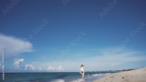 Girl, beach, sea, wind in your hair photo