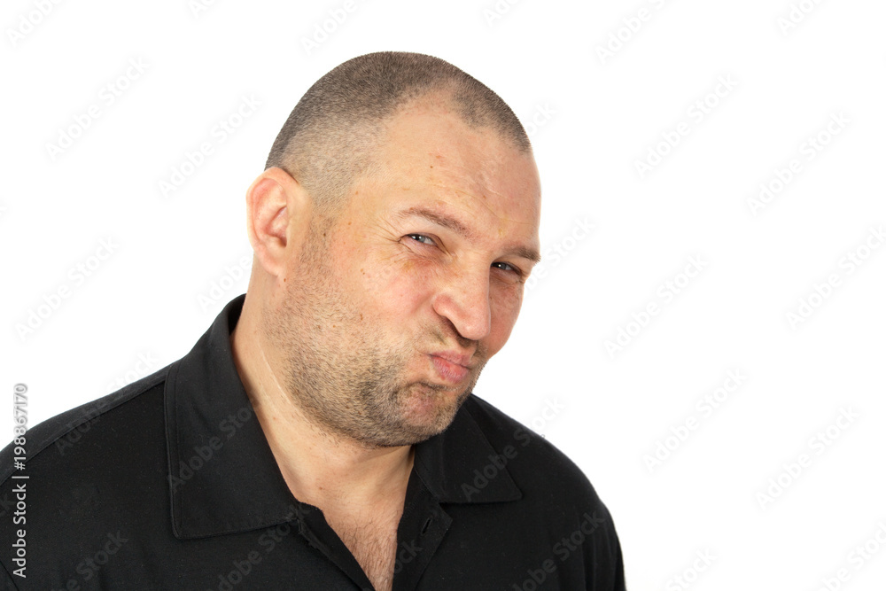 A young man looks skeptical at the interlocutor. Concept emotions skepticism A young man looks skeptical at the interlocutor. Concept emotions skepticism