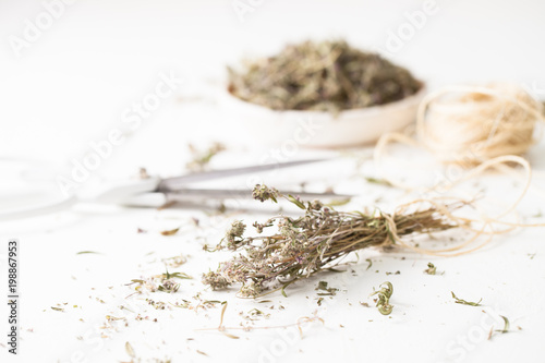 The dried herb thyme on a white table