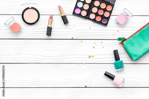Decorative cosmetics for make up on white desk background top view mock up