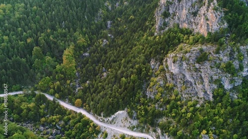 Aerial shot of windy mountain road in woods near Olympus, Greece