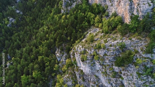 Aerial of cliffs and forrest surrounding mount Olympus, Greece