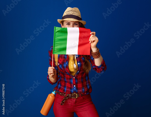 active traveller woman hiding behind flag of Italy