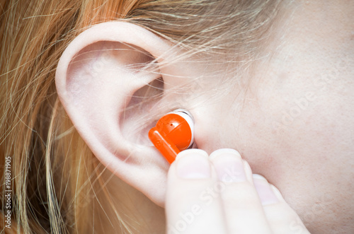 Earphones in a Girl's Ear