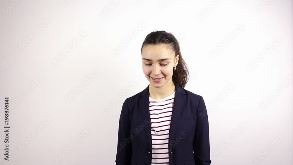 Young woman with big eyes smiling looking at camera. Gesture of kisses Young woman with big eyes smiling looking at camera. Gesture of kisses