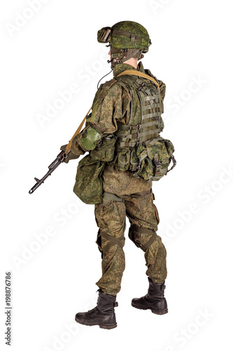 russian special forces soldier with rifle on dark background. army, military and people concept