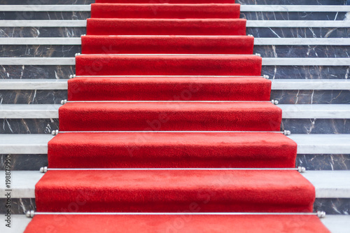 Red carpet on the marble staircase