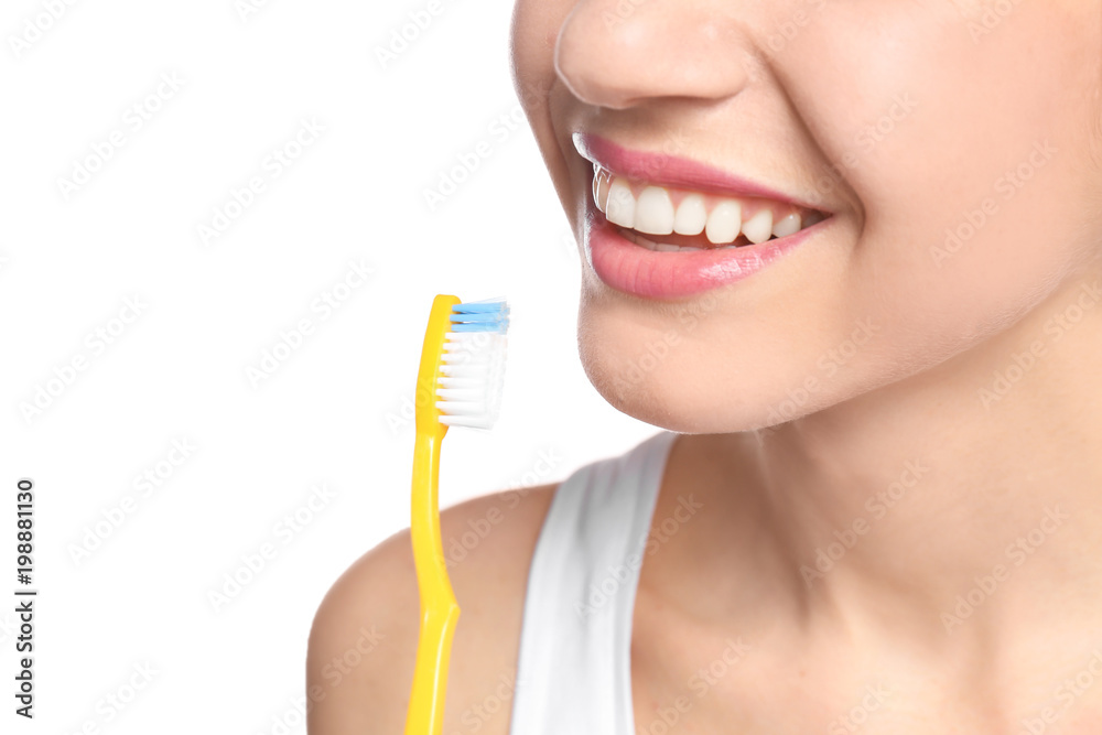 Young woman brushing her teeth on white background, closeup Young woman brushing her teeth on white background, closeup
