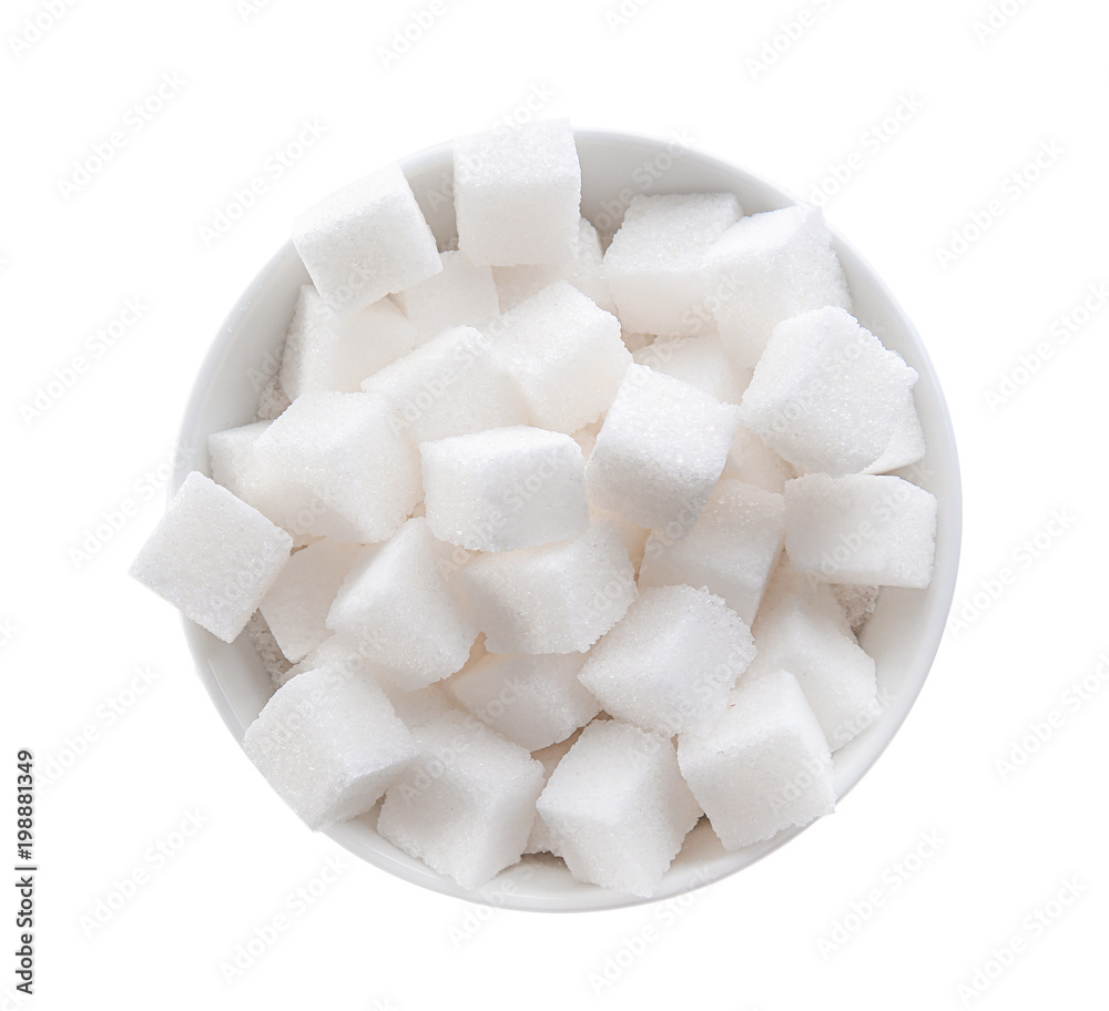 Refined sugar cubes in bowl on white background, top view