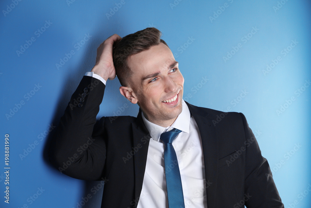 Portrait of young man with beautiful hair on color background Portrait of young man with beautiful hair on color background