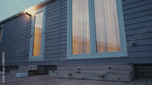 Modern static caravan. mobile House. evening time, in the windows light