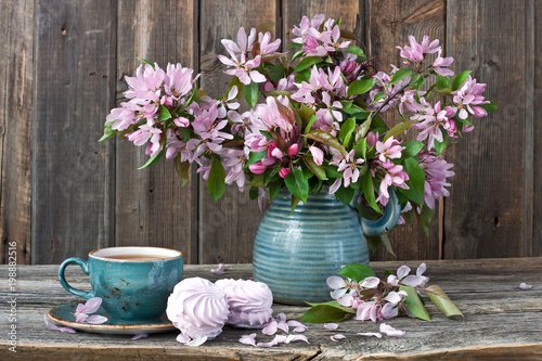 Composition with spring flowers, tea cup  and sweet zephyr