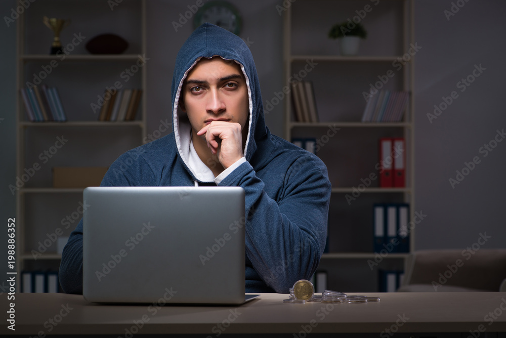Hacker hacking the data late at night Hacker hacking the data late at night