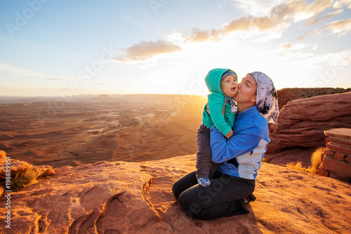 A mother and her baby son visit Canyonlands National park in Utah, USA