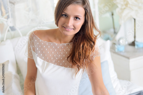 Young woman in the bedroom.
