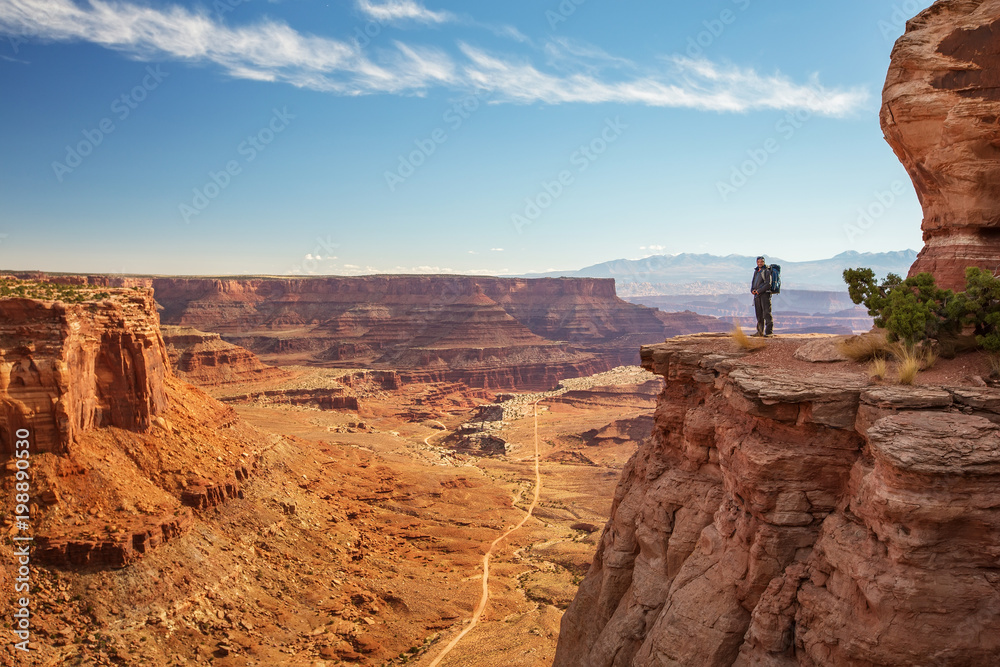 Hiker in Canyonlands National park in Utah, USA Hiker in Canyonlands National park in Utah, USA