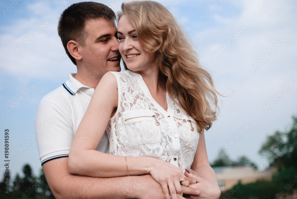 Young beautiful couple walking outdoor