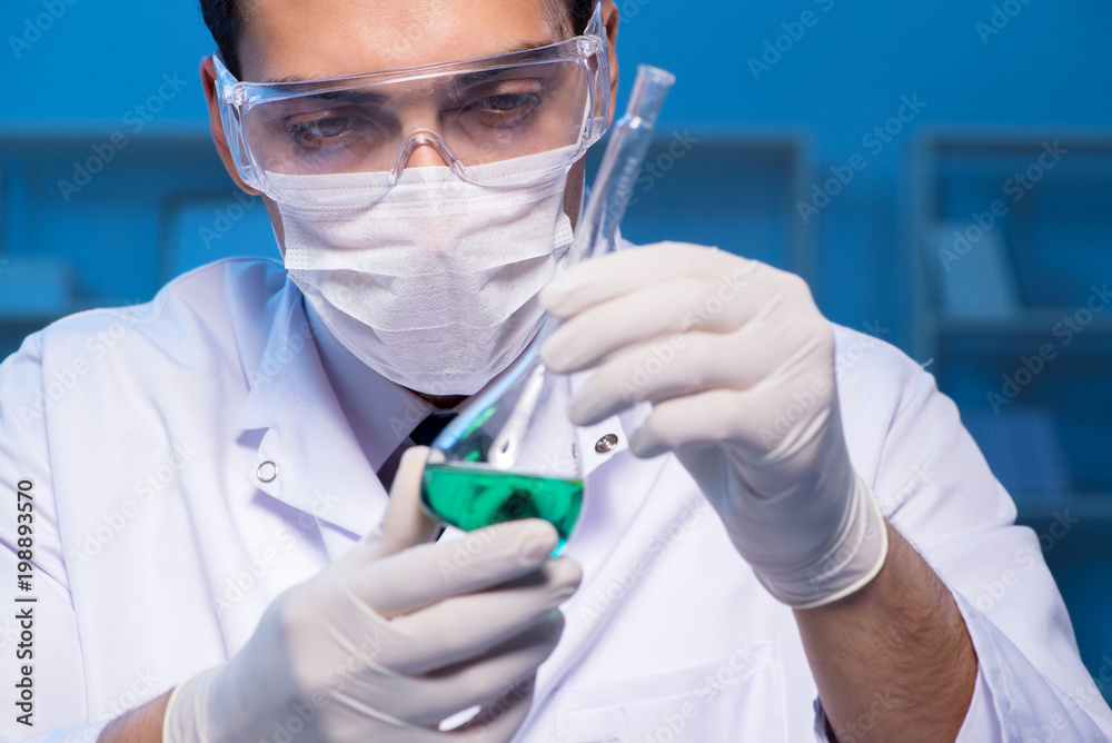 Chemistry assistant working in the chemical lab Chemistry assistant working in the chemical lab