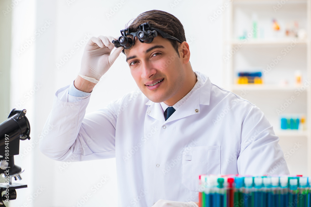 Young chemical scientist working in lab