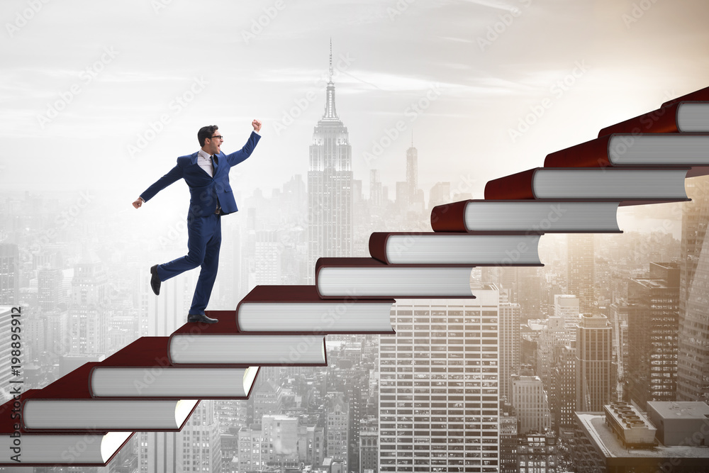Businessman student climbing the ladder of education books Businessman student climbing the ladder of education books
