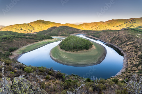 meander of river with mountains © charlymorlock