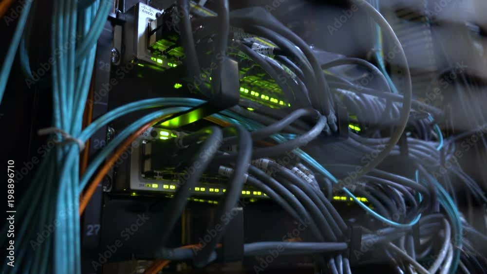 MOSCOW, RUSSIA - March 31: Modern network switch with cables. Flashing server lamp, switch, router. Severs computer in a rack at the large data center. March 31. 2018 Editorial