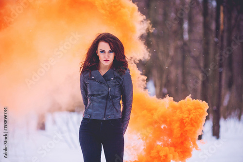 girl against the background of the winter forest photo