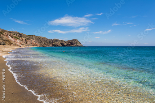 Beach with crystal sea water in Paleochori bay on Milos island in Greece.