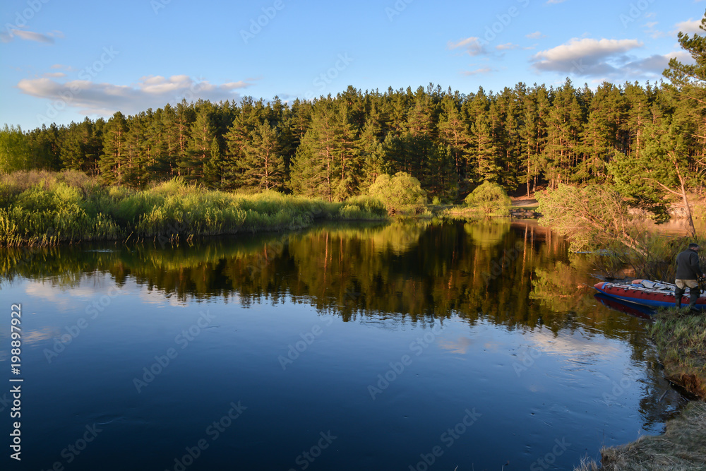 May evening on the forest river.