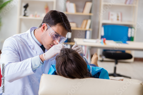 Patient visiting dentist for regular check-up and filling