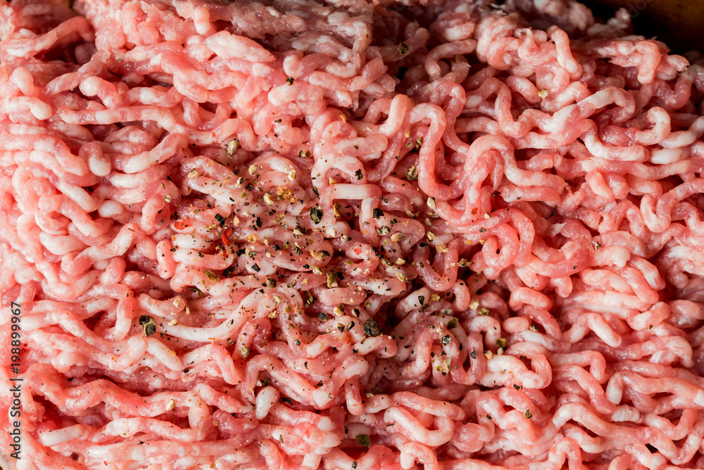 minced pork, Minced meat texture close up - top view minced meat raw fresh macro. Close-up with pepper, salt spices cooking cutlets. minced pork, Minced meat texture close up - top view minced meat raw fresh macro. Close-up with pepper, salt spices cooking cutlets.