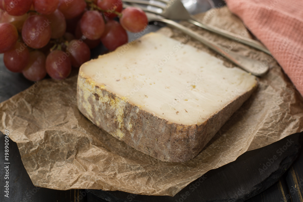 Tasting of ancient french demi soft cheese Tomme from French Alps, made from cow, goat or sheep skim milk, low fat french cheese