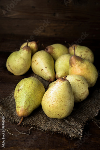 pears on canvas and wooden board