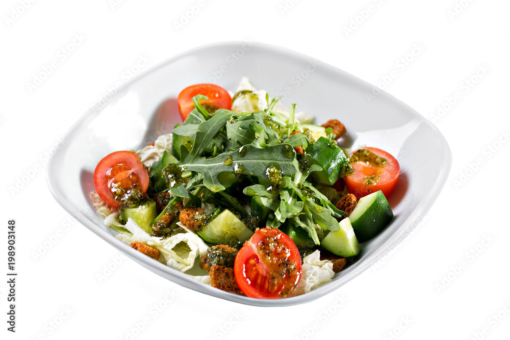 Greek salad. Vegetable with arugula leaves, green salad, with cherry tomatoes, fetta cheese, red onion, and mixed greens