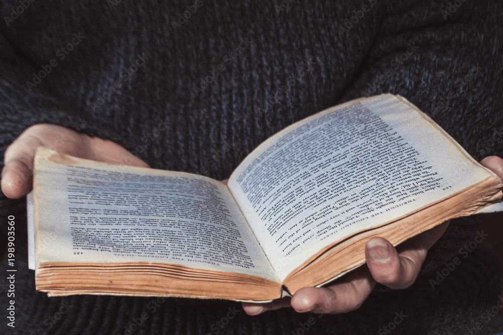 Fototapeta premium The book in the hands