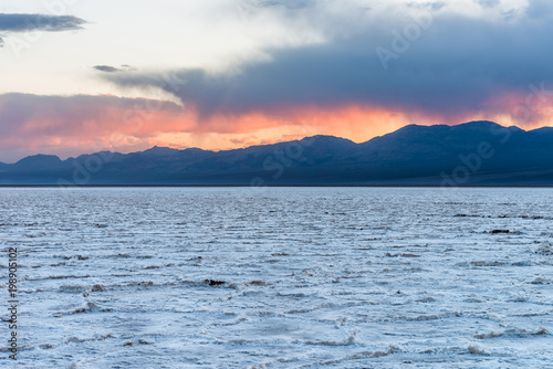Sunset at Sea of Salt - A Spring sunset view of salt flats of Badwater Basin at base of Panamint Range. Death Valley National Park, California, USA.