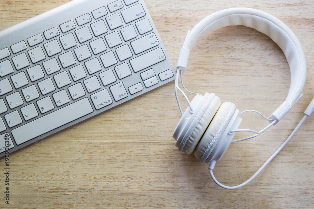 office headphones and white keyboard office headphones and white keyboard