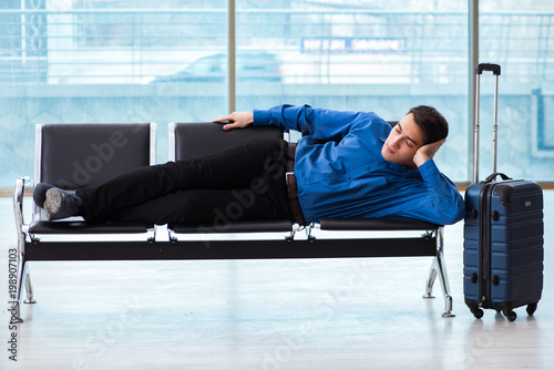 Man wairing to boarding in airport lounge room photo