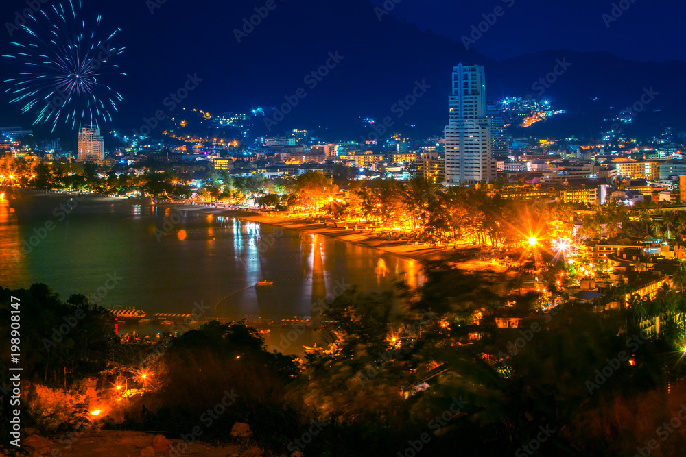 Naklejka premium Thailand. the island of Phuket. Night view of Patong beach. Salute above the island of Phuket. Travel to Thailand.