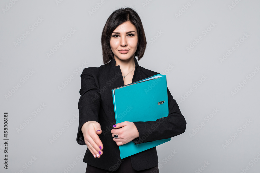 Happy young businesswoman holding documents ready to handshake isolated on white background Happy young businesswoman holding documents ready to handshake isolated on white background