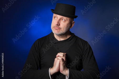 The man folded his hands in...