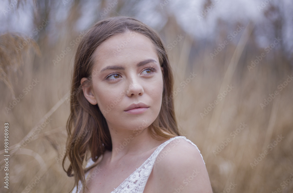 Portrait of beautiful young girl in white dress outdoors Portrait of beautiful young girl in white dress outdoors