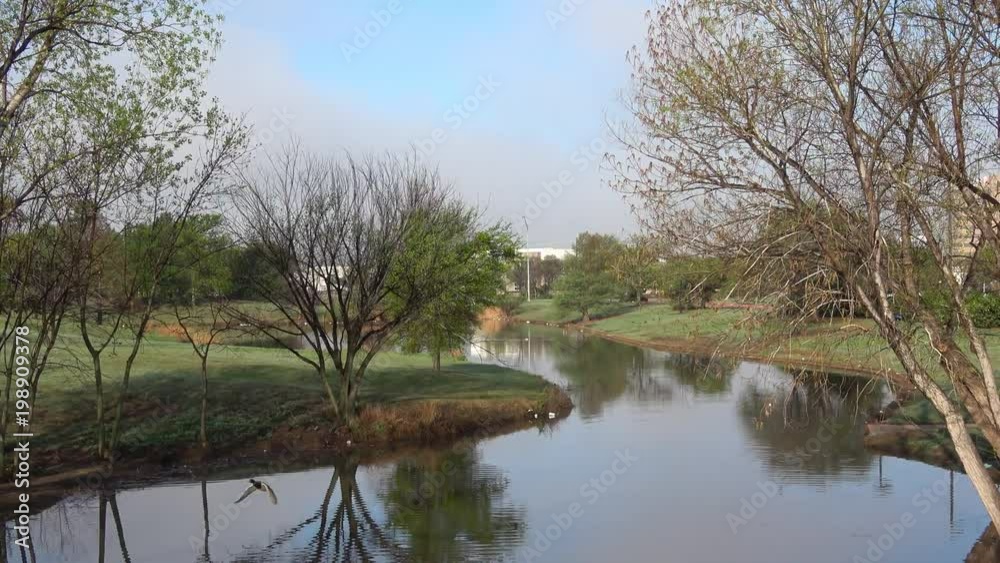View of beautiful landscape with lake in a morning of early spring. View of beautiful landscape with lake in a morning of early spring.
