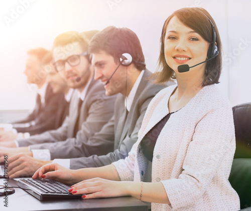 female customer service representative and colleagues in the cal