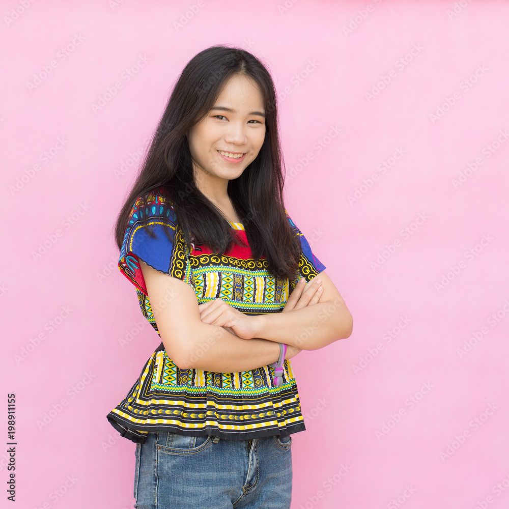 Portrait beautiful Asian girl in casual wear isolated on pink background